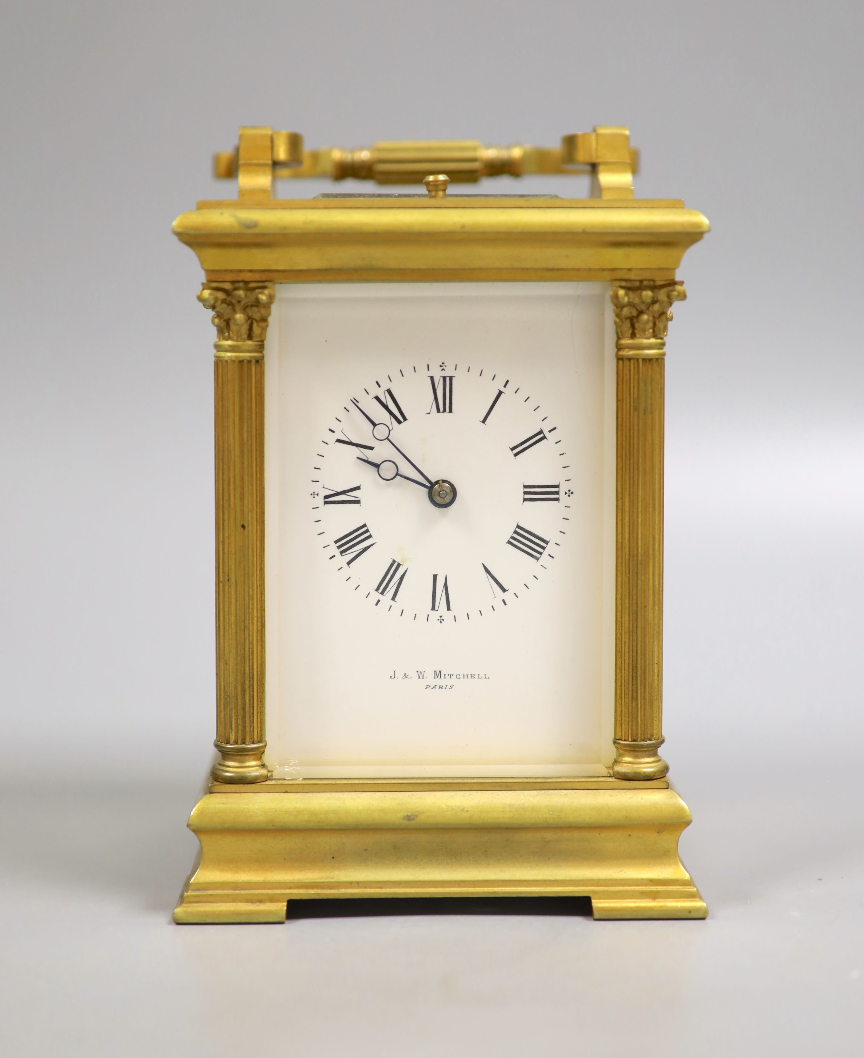 An early 20th century French brass Corinthian pattern repeating carriage clock, 19cm high handle up